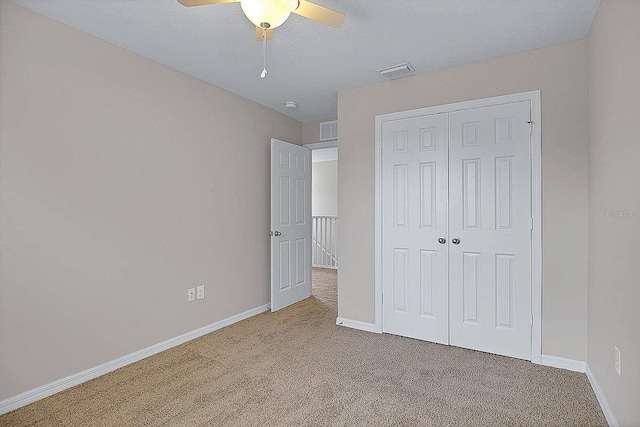 16016 Persimmon Grove Dr, Lithia, FL 33547 - unfurnished bedroom featuring carpet floors, baseboards, a closet, and a ceiling fan