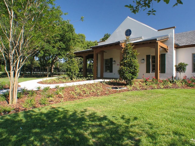 16016 Persimmon Grove Dr, Lithia, FL 33547 - view of front of property featuring a front yard and stucco siding