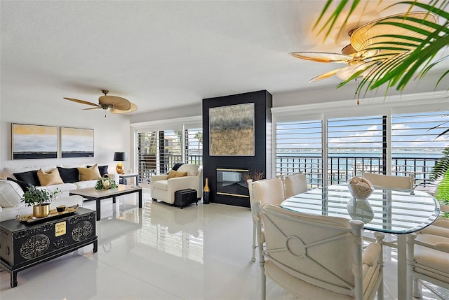 7520 Sunshine Skyway Ln S Unit 109, Saint Petersburg, FL 33711 - living area featuring tile patterned floors, ceiling fan, and a large fireplace