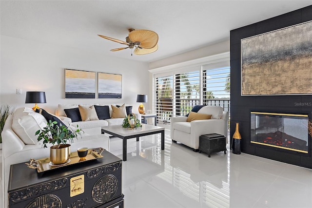 7520 Sunshine Skyway Ln S Unit 109, Saint Petersburg, FL 33711 - living area with tile patterned floors, a glass covered fireplace, and ceiling fan