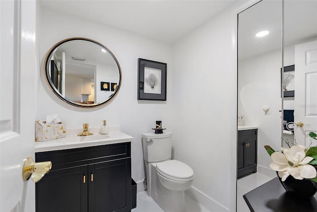 7520 Sunshine Skyway Ln S Unit 109, Saint Petersburg, FL 33711 - bathroom featuring vanity, baseboards, toilet, and tile patterned floors