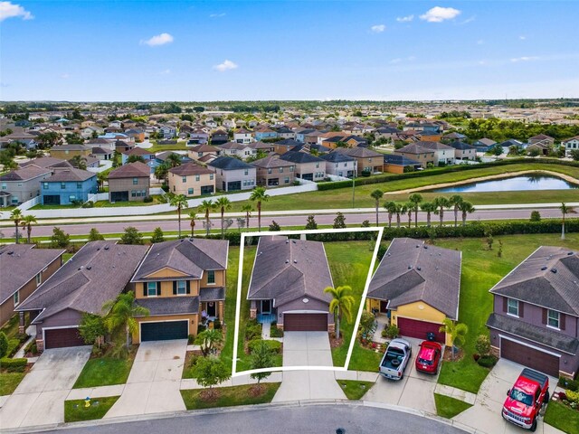 1321 Custer Bayou St, Ruskin, FL 33570 - aerial perspective of suburban area featuring a large body of water and property parcel outlined
