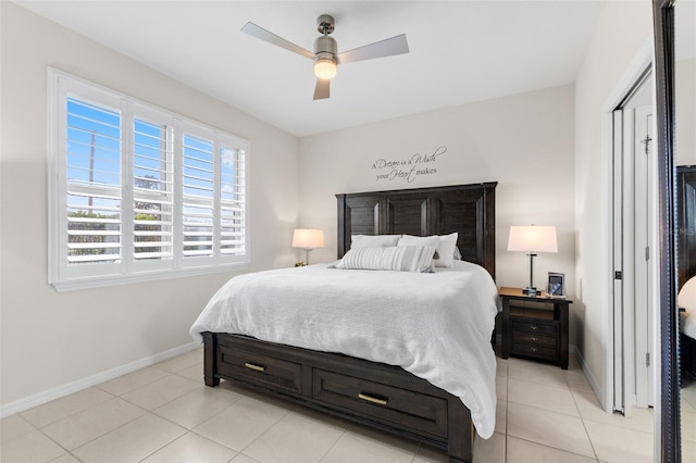 1321 Custer Bayou St, Ruskin, FL 33570 - bedroom featuring baseboards, light tile patterned flooring, and ceiling fan