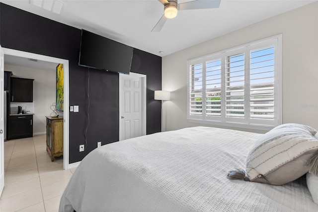 1321 Custer Bayou St, Ruskin, FL 33570 - bedroom with light tile patterned floors, a closet, ceiling fan, and baseboards
