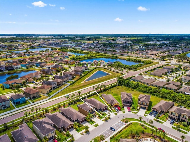 1321 Custer Bayou St, Ruskin, FL 33570 - aerial view of residential area featuring a nearby body of water