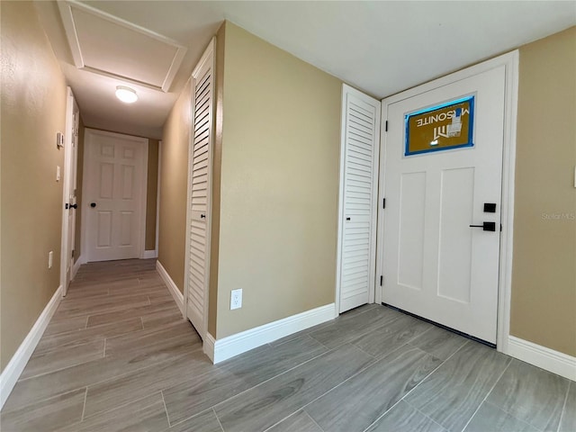 440 89th Ave, St Pete Beach, FL 33706 - entryway with baseboards and light wood-style flooring