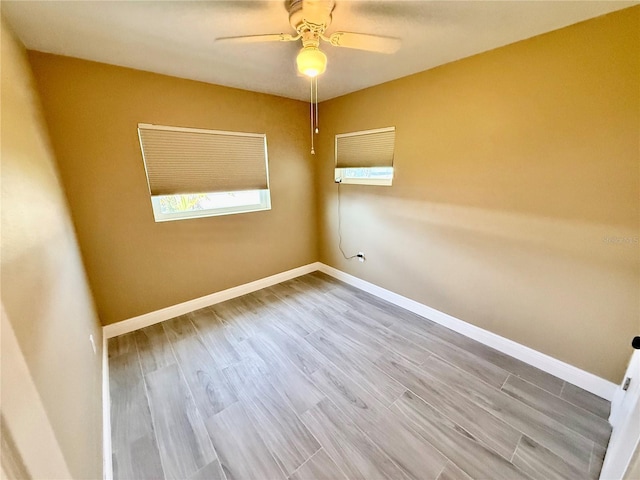440 89th Ave, St Pete Beach, FL 33706 - empty room with ceiling fan, wood finished floors, and baseboards