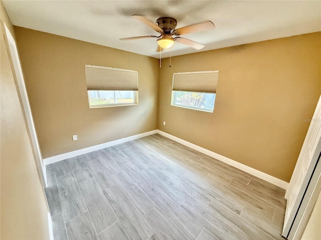 440 89th Ave, St Pete Beach, FL 33706 - empty room featuring a ceiling fan, wood finished floors, and baseboards