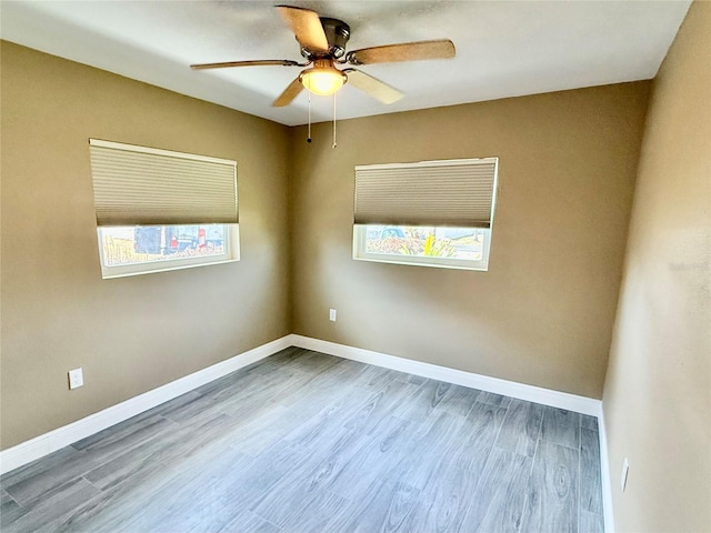 440 89th Ave, St Pete Beach, FL 33706 - unfurnished room with ceiling fan, wood finished floors, and baseboards