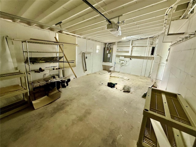 440 89th Ave, St Pete Beach, FL 33706 - garage with water heater, a garage door opener, and concrete block wall