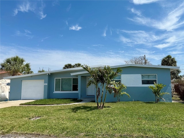 440 89th Ave, St Pete Beach, FL 33706 - ranch-style house featuring an attached garage, a front yard, driveway, and stucco siding