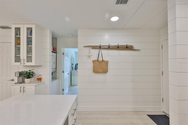 230 Medallion Blvd Unit F, Madeira Beach, FL 33708 - mudroom featuring light wood finished floors