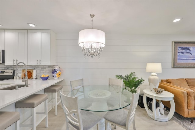 230 Medallion Blvd Unit F, Madeira Beach, FL 33708 - dining room with recessed lighting and a chandelier