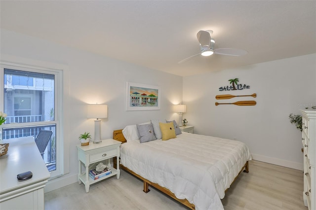 230 Medallion Blvd Unit F, Madeira Beach, FL 33708 - bedroom featuring light wood-style floors, baseboards, and a ceiling fan