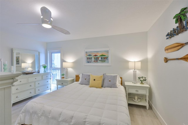 230 Medallion Blvd Unit F, Madeira Beach, FL 33708 - bedroom featuring light wood-style floors, baseboards, and ceiling fan