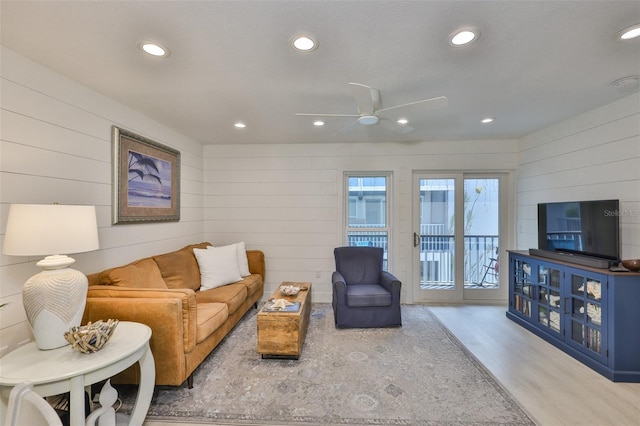 230 Medallion Blvd Unit F, Madeira Beach, FL 33708 - living room featuring ceiling fan, recessed lighting, wood finished floors, and wood walls