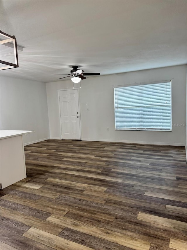 2690 Coral Landings Blvd Unit 217, Palm Harbor, FL 34684 - empty room featuring dark wood-style floors and a ceiling fan