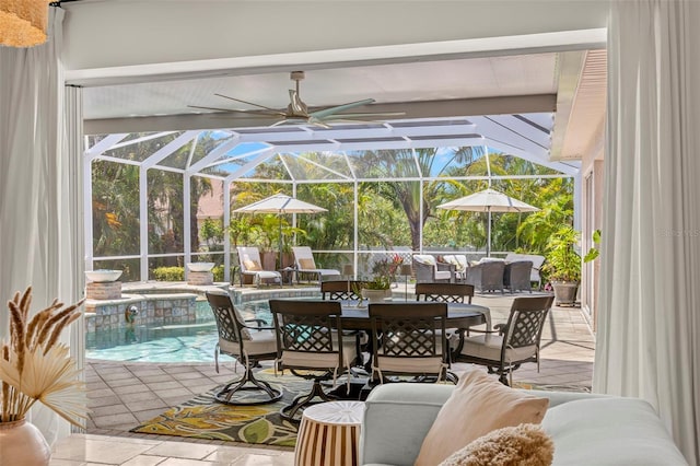 703 Monte Cristo Blvd, Tierra Verde, FL 33715 - view of patio featuring an outdoor pool, glass enclosure, and outdoor dining space