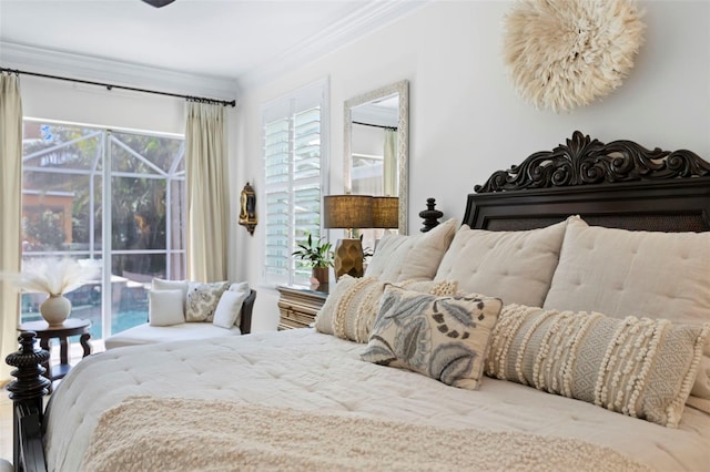 703 Monte Cristo Blvd, Tierra Verde, FL 33715 - bedroom featuring multiple windows, crown molding, and access to outside