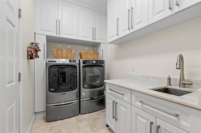 703 Monte Cristo Blvd, Tierra Verde, FL 33715 - washroom with independent washer and dryer, cabinet space, and baseboards