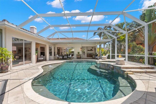 703 Monte Cristo Blvd, Tierra Verde, FL 33715 - view of swimming pool featuring a patio, a pool with connected hot tub, a lanai, and a ceiling fan