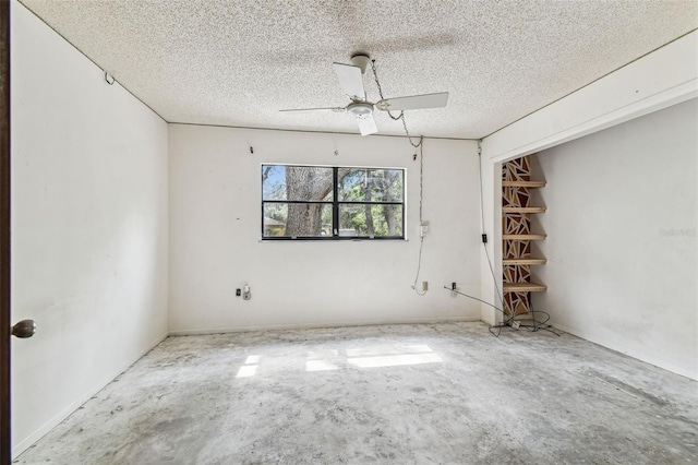 2410 Covington Ave, Spring Hill, FL 34608 - empty room with concrete flooring, a ceiling fan, and a textured ceiling