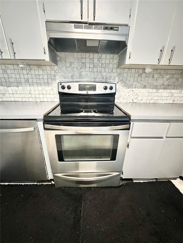 13100 Serpentine Dr, Hudson, FL 34667 - kitchen featuring appliances with stainless steel finishes, under cabinet range hood, light countertops, and white cabinets