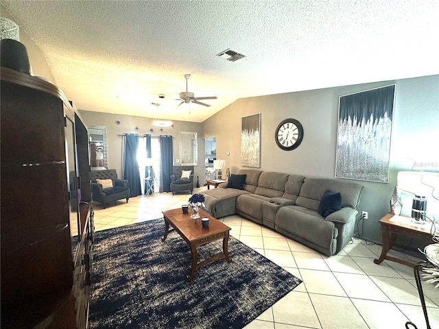13100 Serpentine Dr, Hudson, FL 34667 - living room featuring light tile patterned floors, a textured ceiling, lofted ceiling, and a ceiling fan