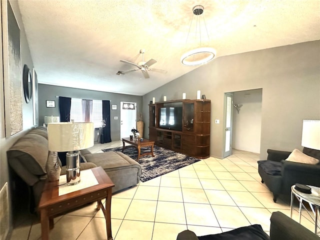 13100 Serpentine Dr, Hudson, FL 34667 - living area featuring lofted ceiling, light tile patterned floors, and ceiling fan