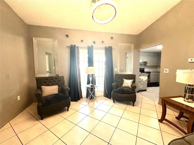 13100 Serpentine Dr, Hudson, FL 34667 - living area with light tile patterned floors and lofted ceiling