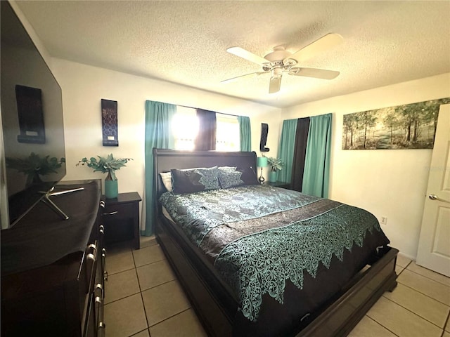 13100 Serpentine Dr, Hudson, FL 34667 - bedroom featuring light tile patterned floors, a textured ceiling, and ceiling fan