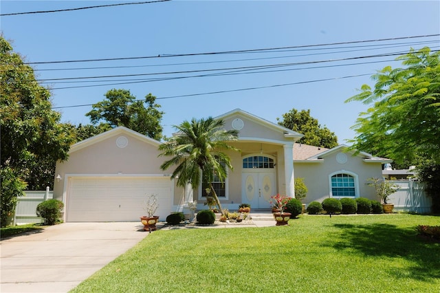3010 Grand View Ave, Clearwater, FL 33759 - view of front facade featuring stucco siding, an attached garage, concrete driveway, and a front yard