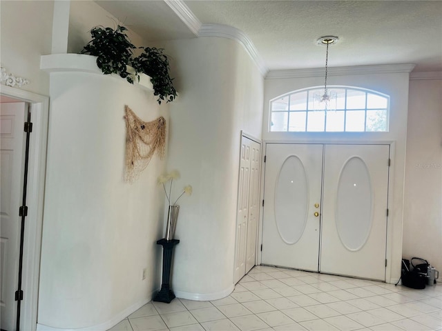 3010 Grand View Ave, Clearwater, FL 33759 - entryway featuring crown molding, a chandelier, light tile patterned flooring, and a textured ceiling