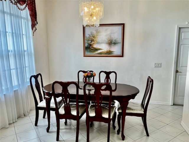 3010 Grand View Ave, Clearwater, FL 33759 - dining room with a chandelier, baseboards, and light tile patterned floors