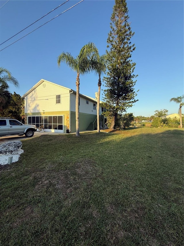 3338 Fernleaf Dr, Hernando Beach, FL 34607 - view of property exterior with a lawn
