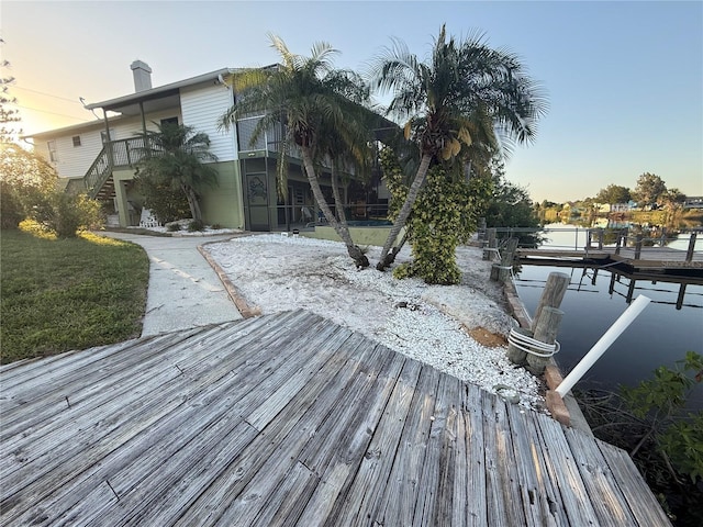 3338 Fernleaf Dr, Hernando Beach, FL 34607 - dock area with stairs and a lawn