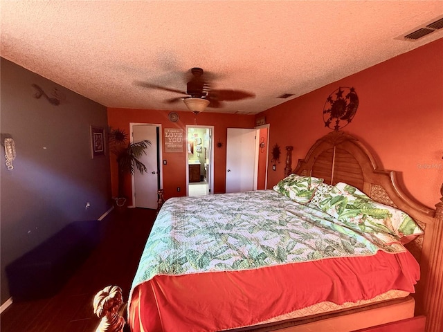 3338 Fernleaf Dr, Hernando Beach, FL 34607 - bedroom with a textured ceiling, wood finished floors, ceiling fan, and baseboards