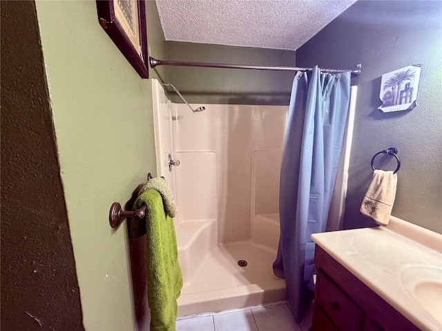 3338 Fernleaf Dr, Hernando Beach, FL 34607 - bathroom featuring a shower with shower curtain, a textured ceiling, vanity, and tile patterned floors