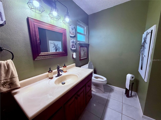 3338 Fernleaf Dr, Hernando Beach, FL 34607 - bathroom featuring toilet, vanity, tile patterned flooring, a textured ceiling, and baseboards