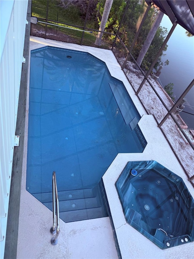 3338 Fernleaf Dr, Hernando Beach, FL 34607 - outdoor pool with an in-ground hot tub and a lanai