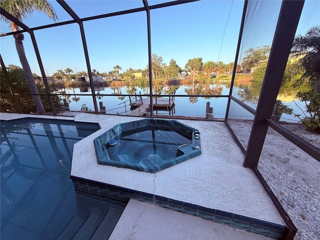 3338 Fernleaf Dr, Hernando Beach, FL 34607 - swimming pool featuring a water view, glass enclosure, and an in-ground hot tub