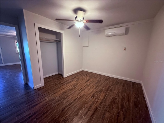 3338 Fernleaf Dr, Hernando Beach, FL 34607 - unfurnished bedroom featuring an AC wall unit, dark wood finished floors, baseboards, a closet, and ceiling fan