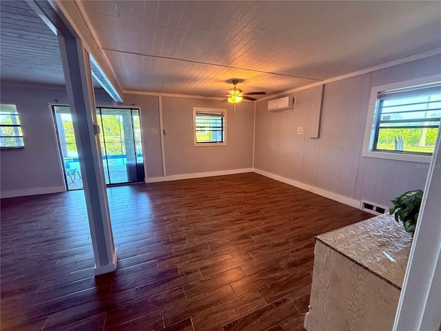 3338 Fernleaf Dr, Hernando Beach, FL 34607 - empty room featuring a wall mounted AC, a baseboard radiator, dark wood-type flooring, plenty of natural light, and crown molding