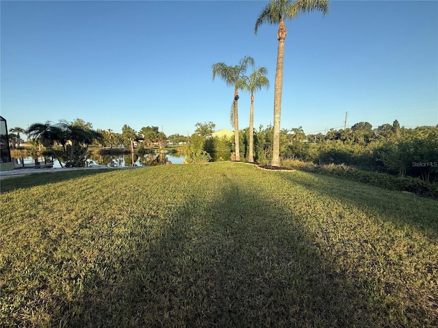 3338 Fernleaf Dr, Hernando Beach, FL 34607 - view of green lawn featuring a water view