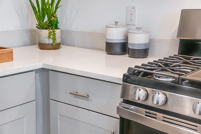12435 Gust Ct, Hudson, FL 34669 - kitchen view of gas range and light countertops