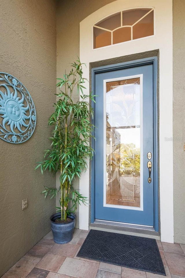 1110 Jasmine Creek Ct, Sun City Center, FL 33573 - property entrance with stucco siding