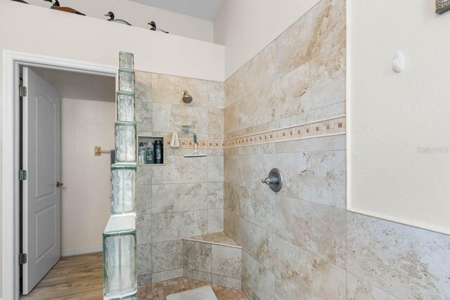 1110 Jasmine Creek Ct, Sun City Center, FL 33573 - full bath with tiled shower and wood finished floors