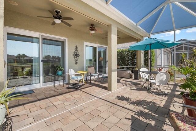 1110 Jasmine Creek Ct, Sun City Center, FL 33573 - view of patio featuring ceiling fan and a lanai