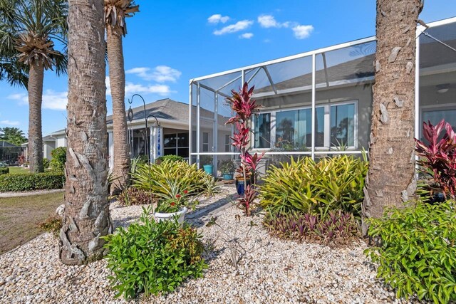 1110 Jasmine Creek Ct, Sun City Center, FL 33573 - back of house with a lanai and roof with shingles