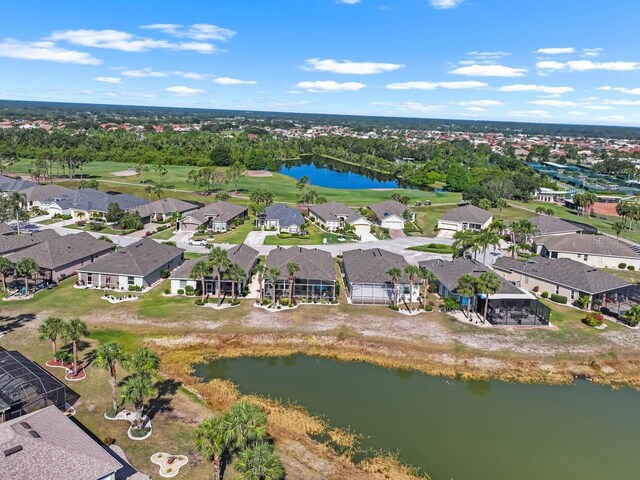 1110 Jasmine Creek Ct, Sun City Center, FL 33573 - aerial view of property's location with a large body of water, nearby suburban area, and a golf club